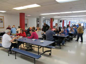 People Enjoying Spaghetti at Canandaigua Academy Cafeteria