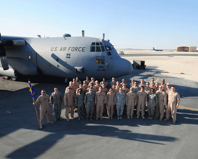 Troops standing in front of large transport Airplane